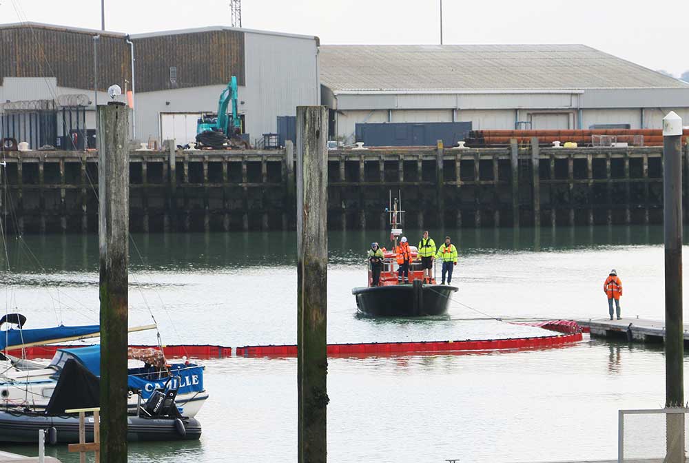 Responders from Newhaven Port Authority and Newhaven Marina taking part in an oil spill exercise on a pilot vessel in Newhaven port