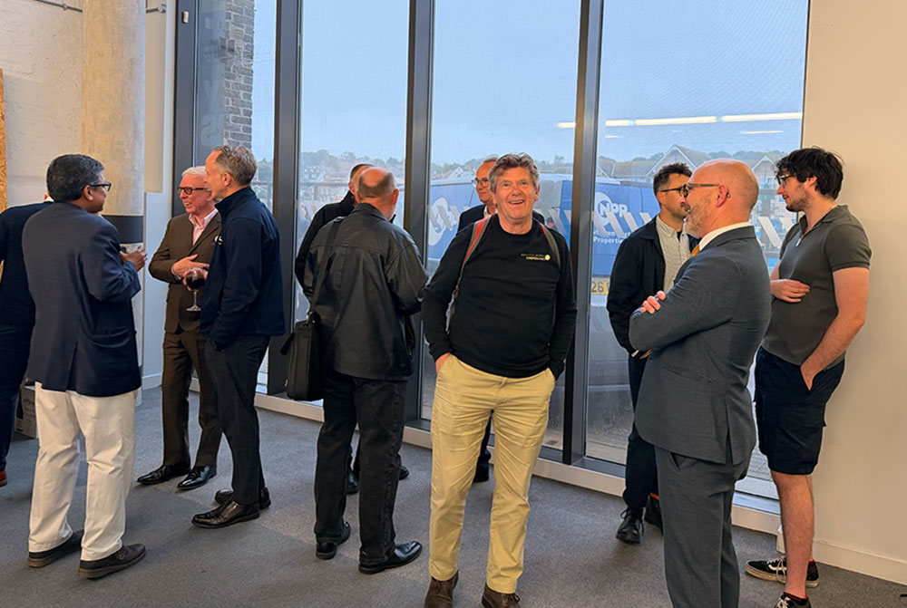 People talking at the GreenPortside Exhibition