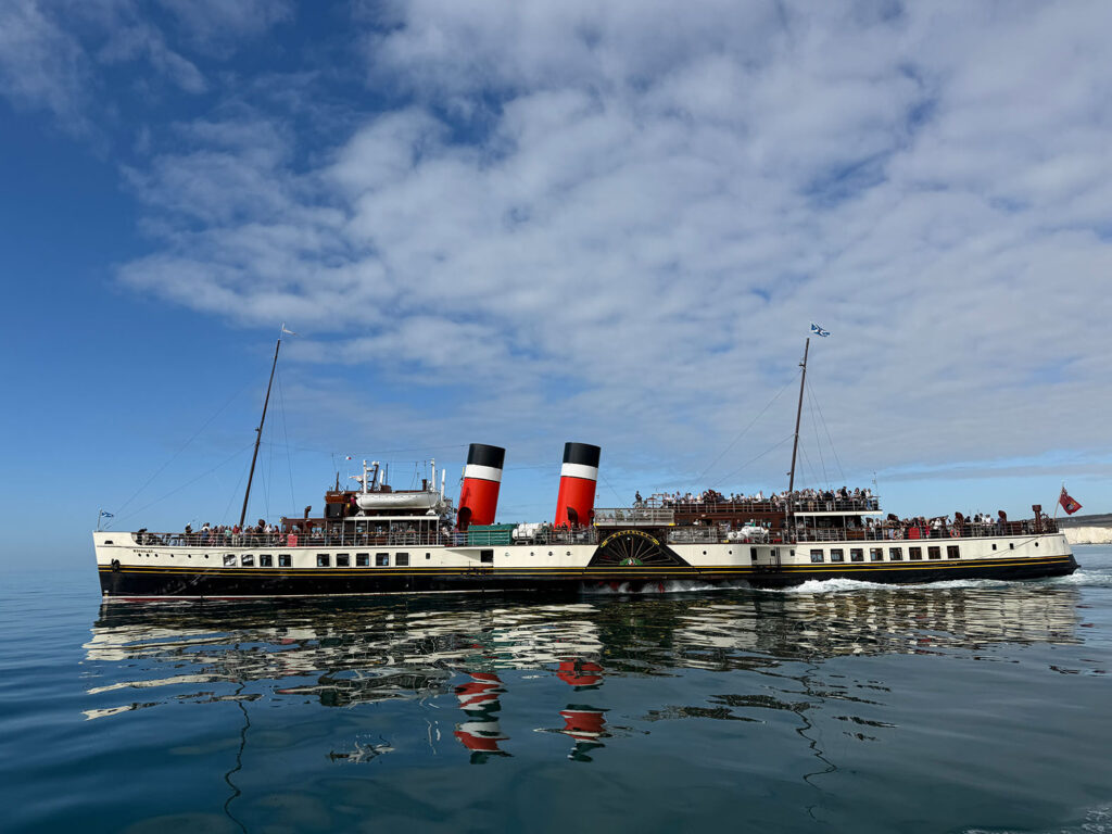 Waverley paddle steamer with passengers on deck leaving Newhaven Port