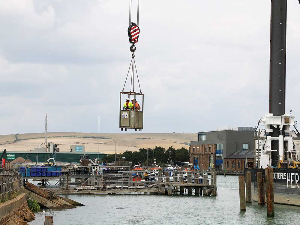 Employees leaving the Octopus platform on a cradle which lifts them across the water to the roadside.