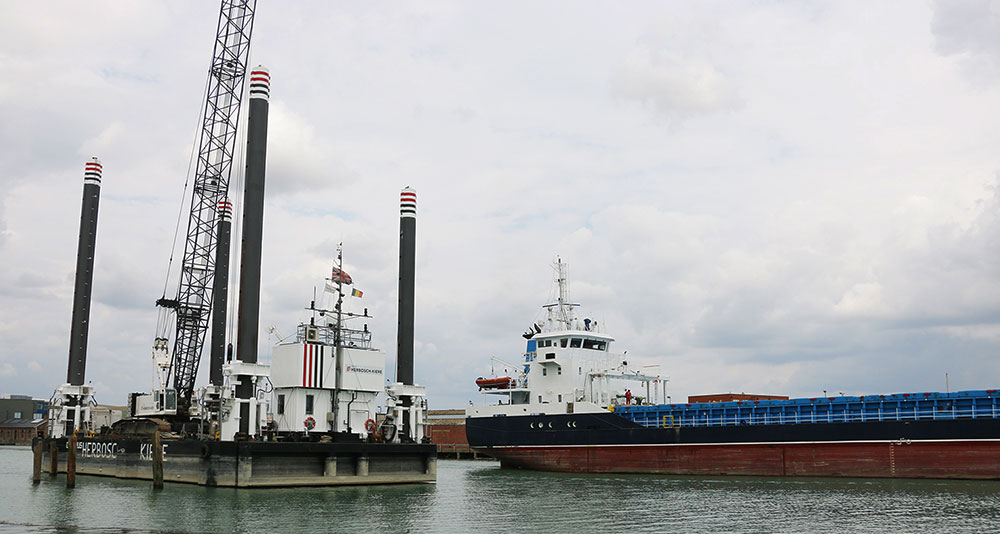 The Eastern Vanquish cargo ship passes the Octopus as it leaves Newhaven Port