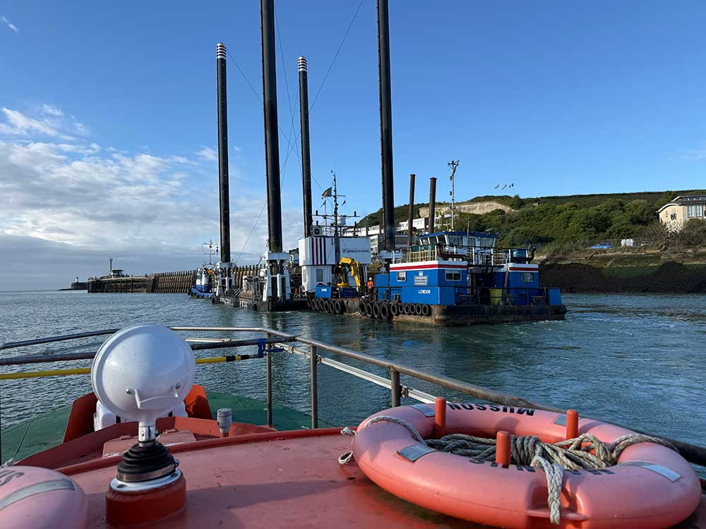 View from the pilot boat at Newhaven Port seeing the Octopus platform leave the harbour