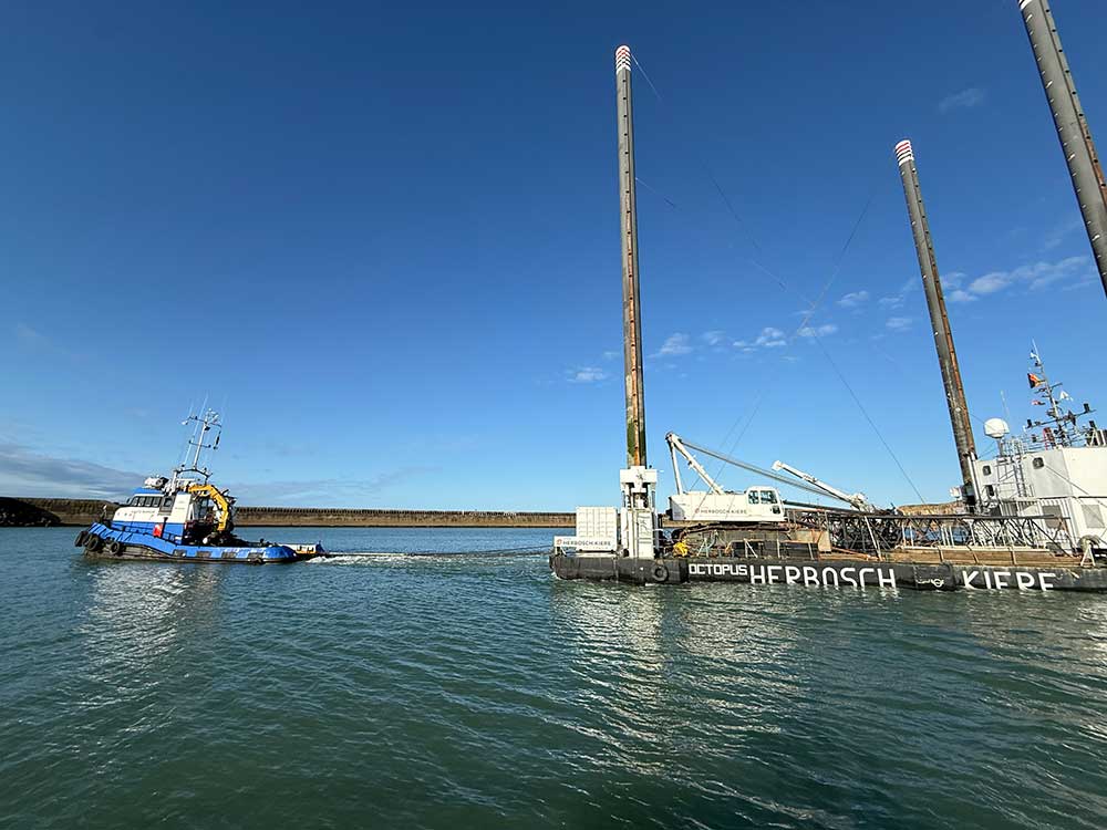The tug shows the strain of towing the Herbosch Kiere Octopus platform out of Newhaven Port