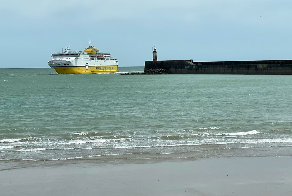 ferry entering newhaven port with lighthouse and west beach area